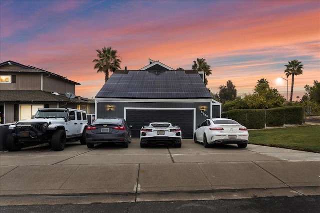 view of front property with solar panels