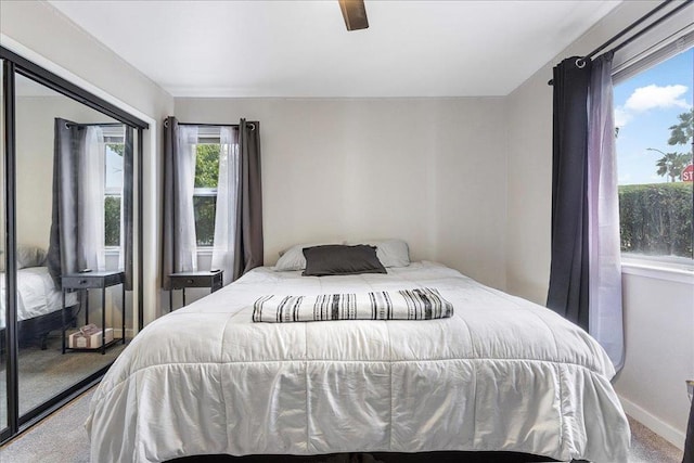 bedroom with ceiling fan and carpet floors