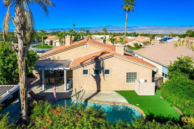 birds eye view of property with a mountain view