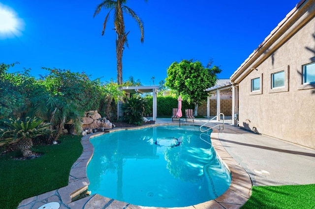 view of pool featuring a patio