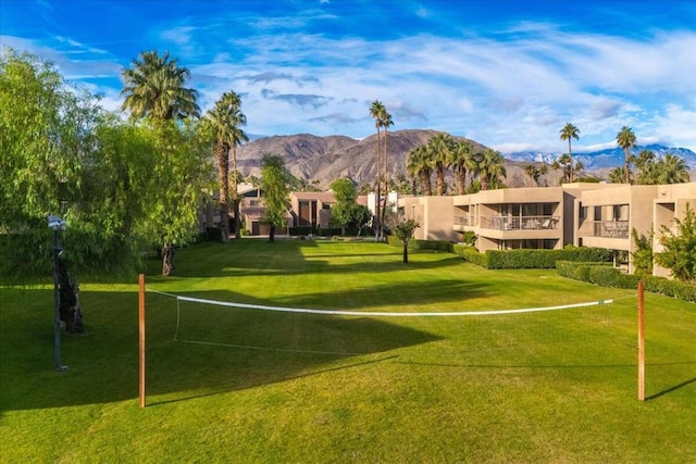 view of community featuring a mountain view and volleyball court