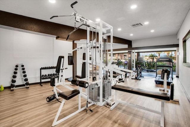 gym featuring hardwood / wood-style floors