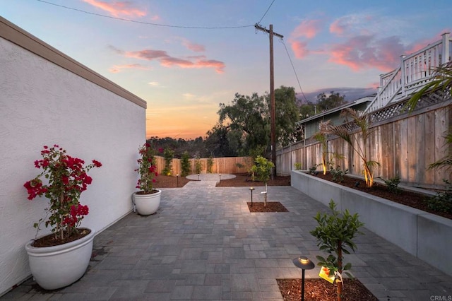 view of patio terrace at dusk