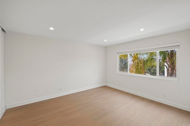 empty room with light wood-type flooring