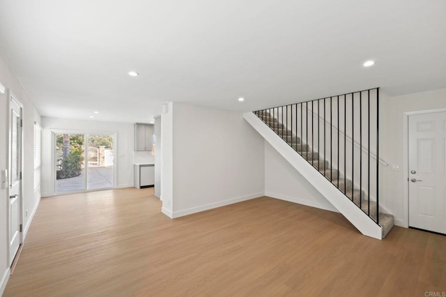 unfurnished living room with light hardwood / wood-style flooring