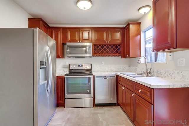 kitchen with sink and appliances with stainless steel finishes