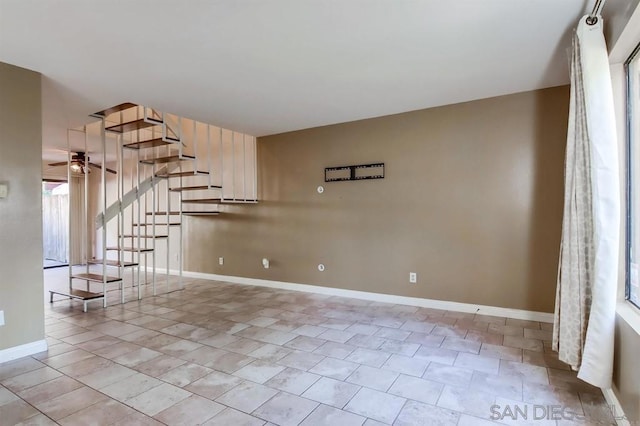 spare room featuring ceiling fan