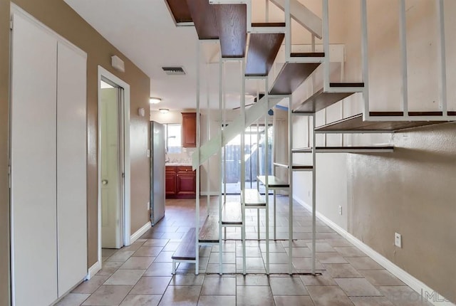 kitchen with light tile patterned floors