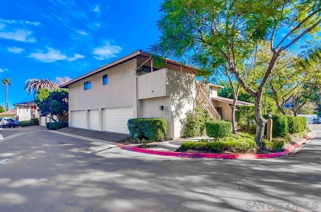 view of property exterior featuring a garage