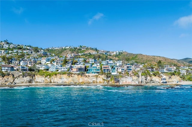 water view featuring a mountain view and a view of the beach