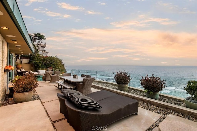 patio terrace at dusk with a water view