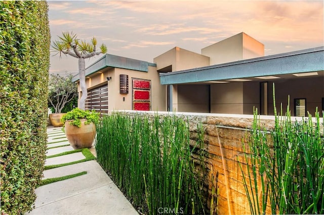 view of property exterior at dusk