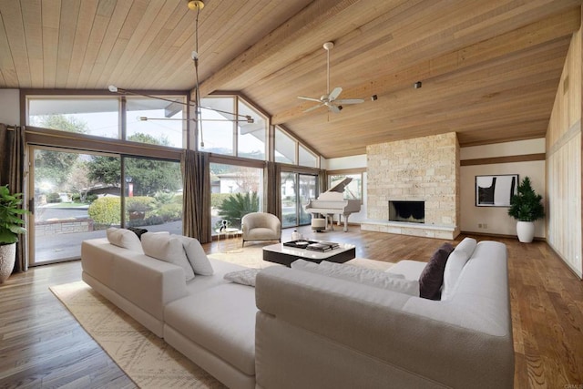 living room with beam ceiling, wood ceiling, wood-type flooring, high vaulted ceiling, and a fireplace