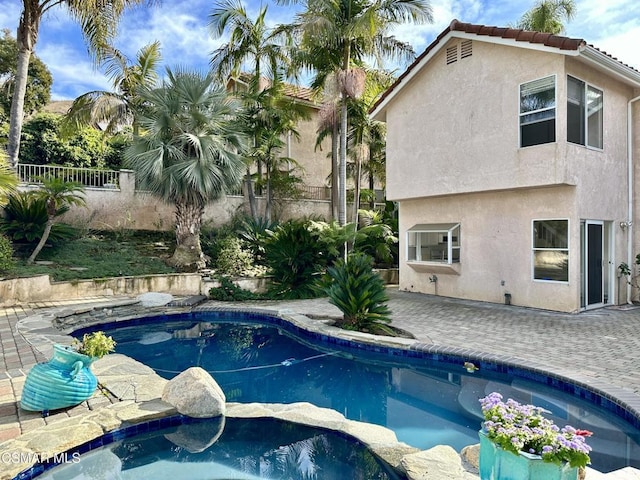 view of swimming pool with a patio area