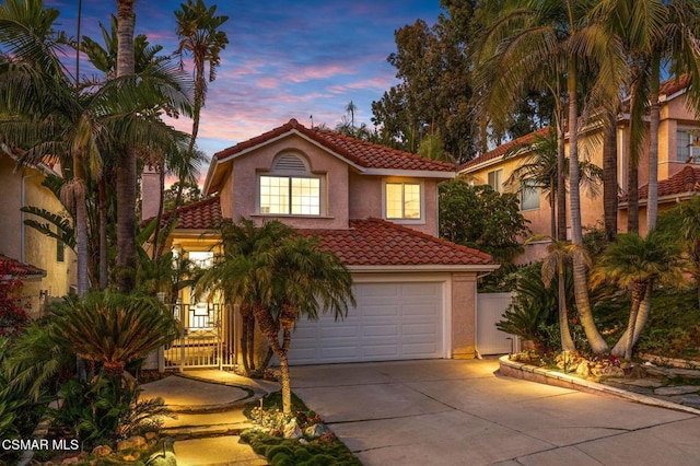 mediterranean / spanish-style home featuring a garage