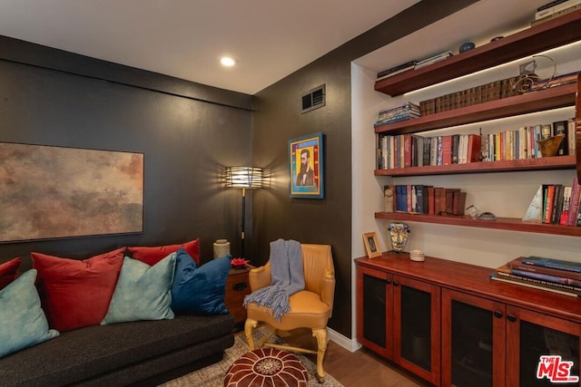 sitting room featuring light hardwood / wood-style floors