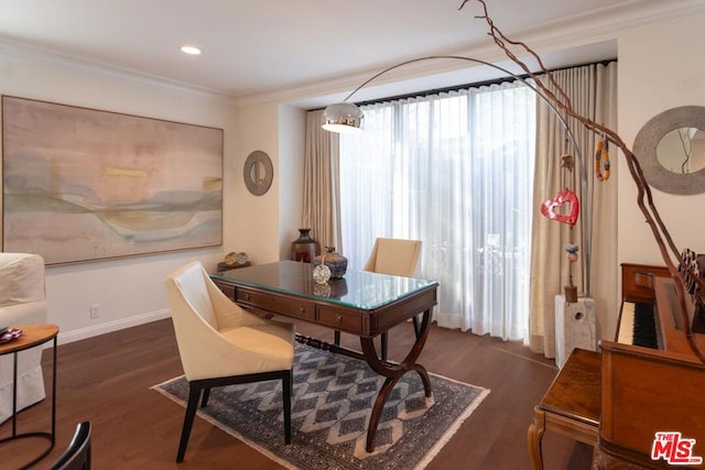 dining space with dark hardwood / wood-style flooring and crown molding