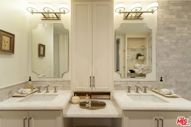 bathroom featuring tasteful backsplash and vanity