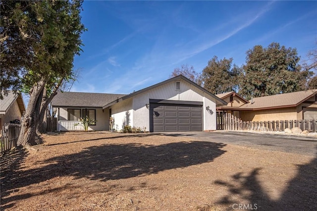 single story home featuring a garage