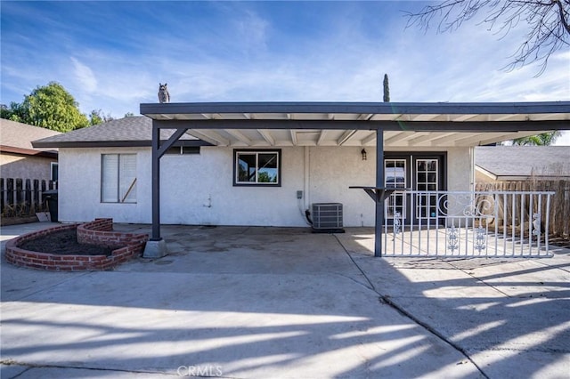 back of house with a patio and central AC