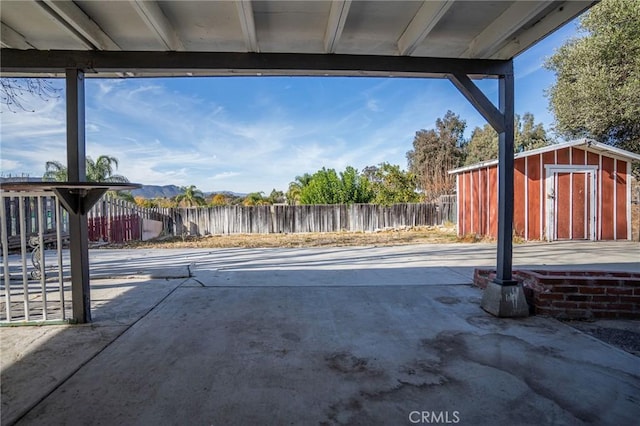 view of patio / terrace with a storage unit