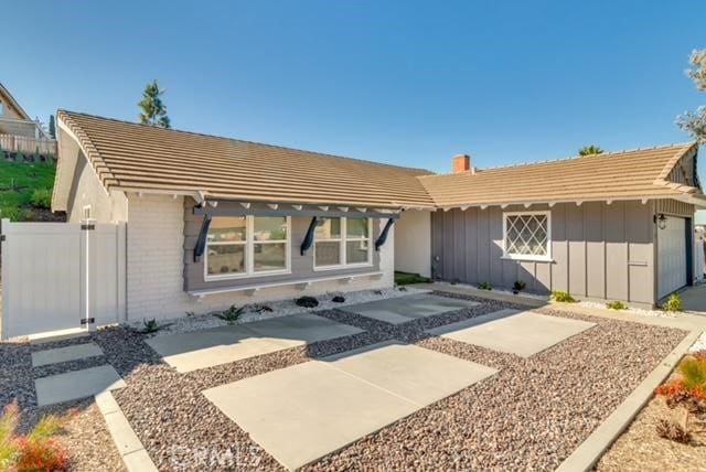 view of front of home featuring a patio