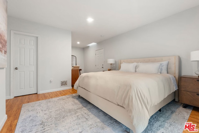 bedroom featuring light hardwood / wood-style floors