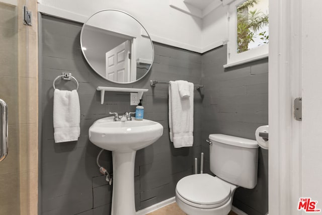 bathroom featuring sink and toilet