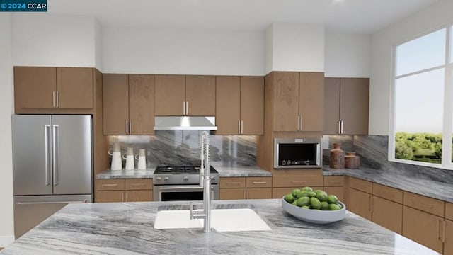 kitchen featuring decorative backsplash and high quality appliances