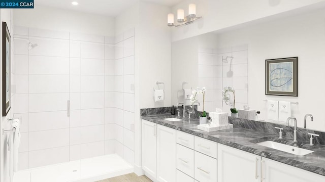 bathroom with vanity and a shower with shower door