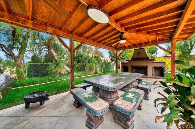 view of patio / terrace featuring an outdoor fireplace