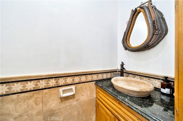 bathroom featuring tile walls and vanity