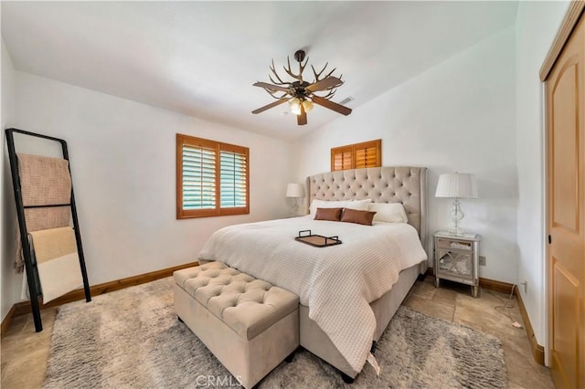 bedroom with a closet, lofted ceiling, and ceiling fan