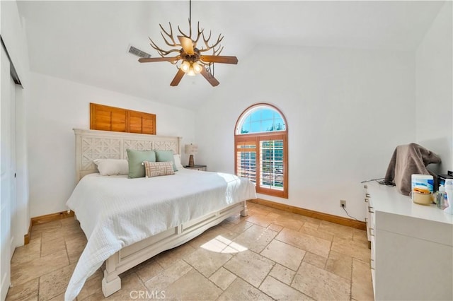 bedroom featuring vaulted ceiling, ceiling fan, and a closet