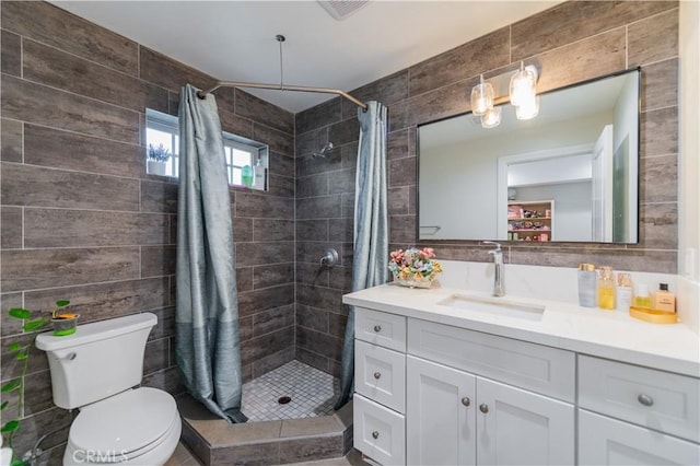 bathroom with tile walls, toilet, and a shower with shower curtain