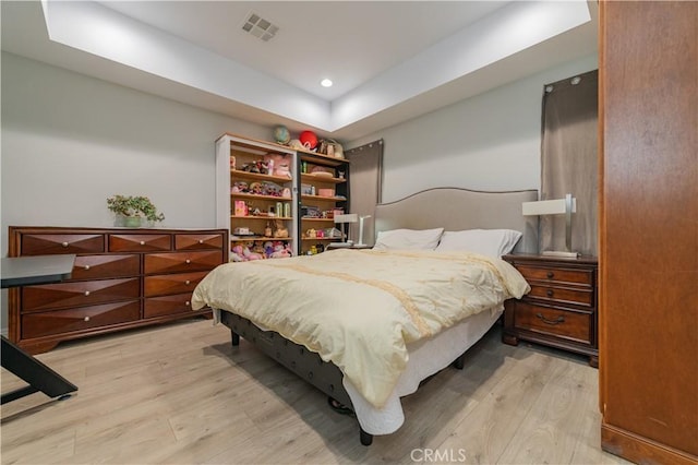 bedroom with light wood-type flooring, visible vents, and recessed lighting