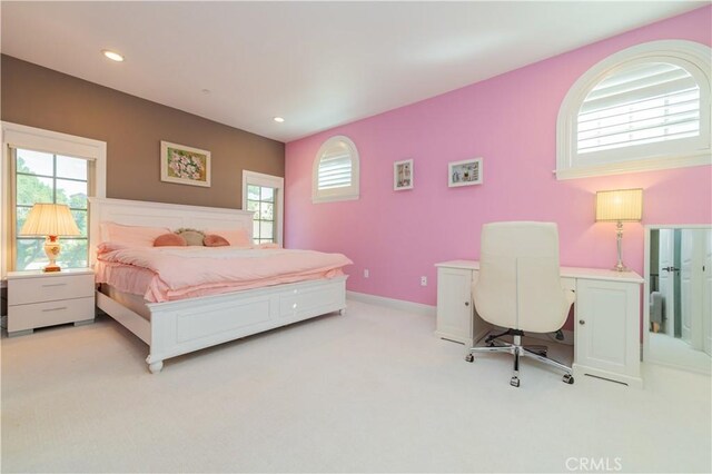 bedroom with light colored carpet