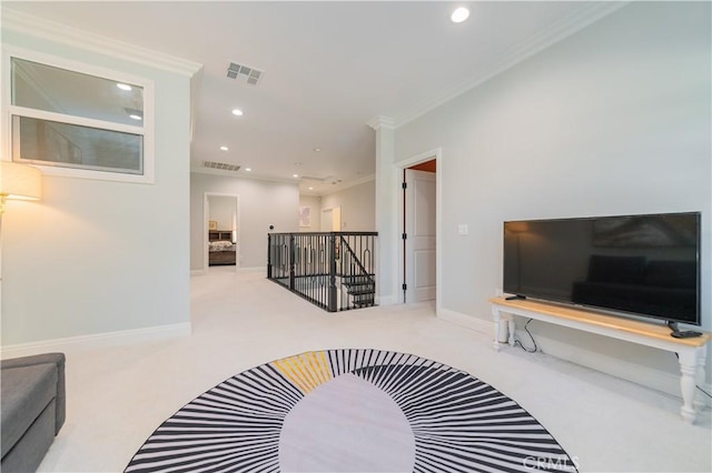 carpeted living room featuring recessed lighting, visible vents, baseboards, and ornamental molding