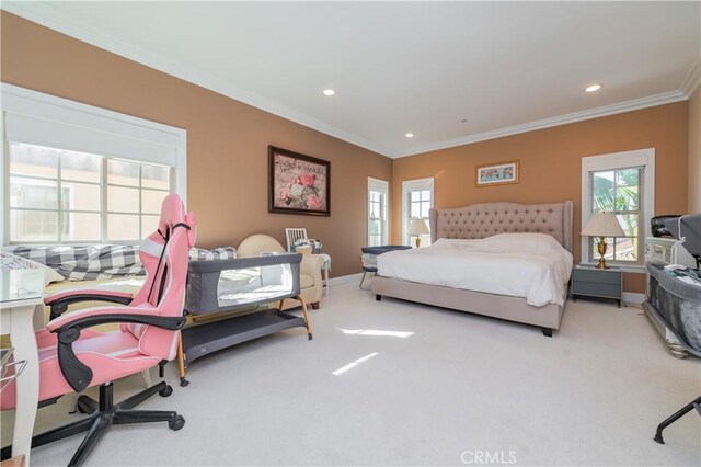 bedroom featuring crown molding, light colored carpet, and multiple windows