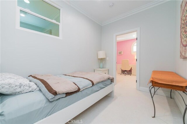 carpeted bedroom featuring ornamental molding