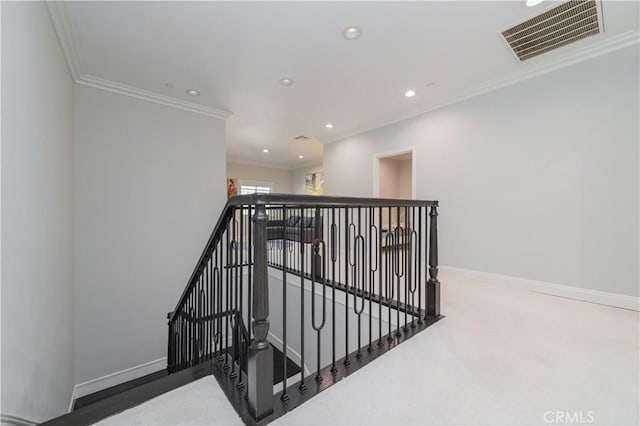 stairway featuring baseboards, visible vents, crown molding, and recessed lighting