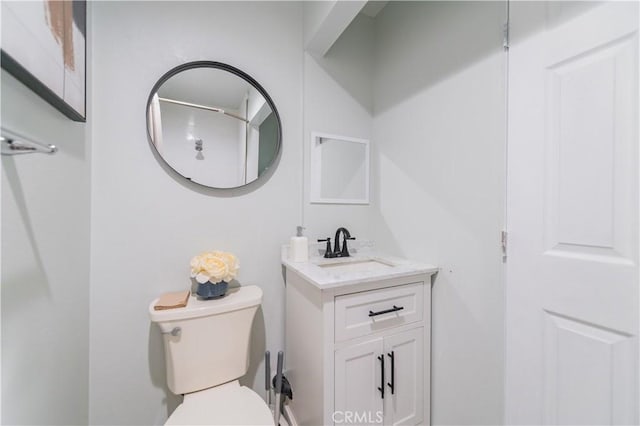 bathroom with toilet and vanity