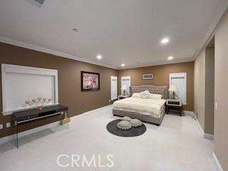 bedroom featuring baseboards, visible vents, ornamental molding, and recessed lighting