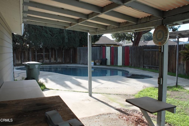 view of swimming pool featuring a patio area