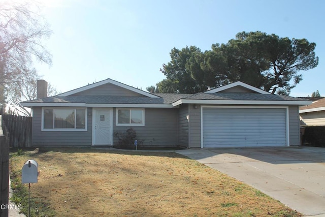 ranch-style home featuring a front yard and a garage