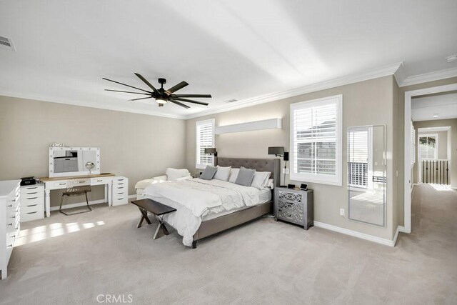 carpeted bedroom featuring multiple windows, crown molding, and ceiling fan