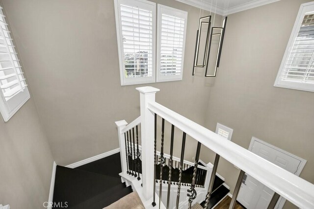 stairs featuring ornamental molding