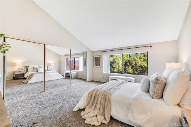 bedroom with carpet floors, a closet, and vaulted ceiling