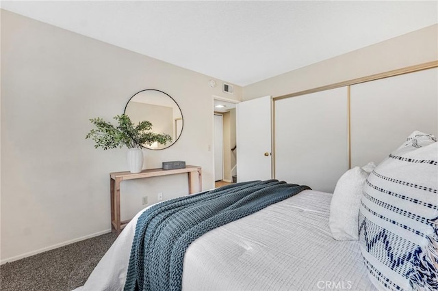 carpeted bedroom with a closet