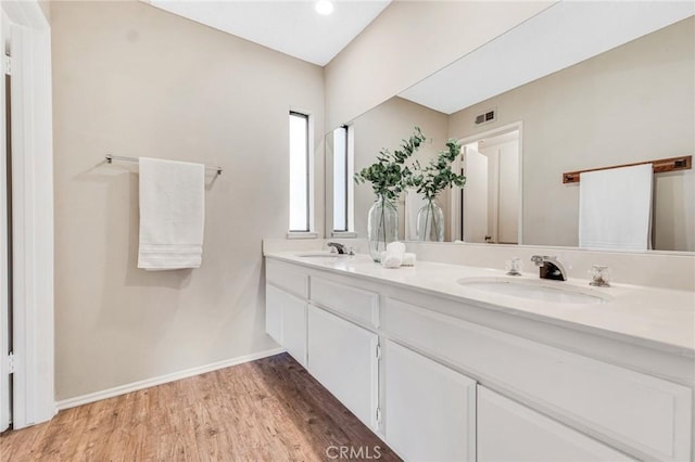 bathroom featuring vanity and hardwood / wood-style floors